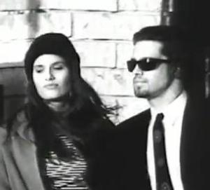 Beard?  Check.  Tie?  Check.  Shades?  Check.  Conclusion: 100% douche.