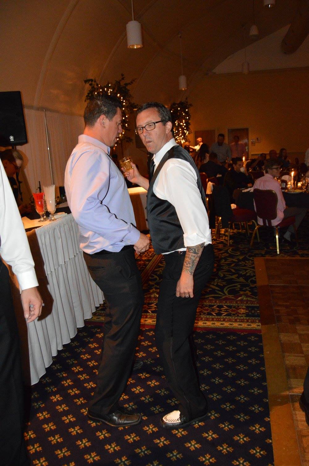 John and Turner dancing at a wedding reception.